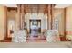 Welcoming entryway with stone pillars, wooden beams, and decorative front door at 10577 Down Lakeview Cir, Windermere, FL 34786