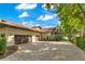 Spacious home featuring a three-car garage with a brick driveway and well-manicured landscaping at 10577 Down Lakeview Cir, Windermere, FL 34786