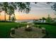 Enjoy the serene lakeside setting with a cozy fire pit and comfortable seating for outdoor gatherings at 10577 Down Lakeview Cir, Windermere, FL 34786
