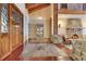 Elegant foyer with hardwood floors, stone accents, and leaded glass door at 10577 Down Lakeview Cir, Windermere, FL 34786