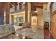 Grand foyer with soaring ceilings, wooden beams, and stone accents at 10577 Down Lakeview Cir, Windermere, FL 34786