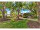 An inviting home with mature trees, lush landscaping, and a circular driveway at 10577 Down Lakeview Cir, Windermere, FL 34786