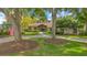 This home features mature trees, a lush lawn, professional landscaping, and a brick walkway at 10577 Down Lakeview Cir, Windermere, FL 34786