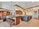 Modern kitchen with center island, barstool seating, and custom cabinetry at 10577 Down Lakeview Cir, Windermere, FL 34786