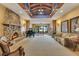 Open living area with stone fireplace, piano, and comfortable seating area at 10577 Down Lakeview Cir, Windermere, FL 34786