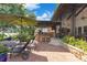 View of the outdoor kitchen and bar, pool, lounge area, and manicured backyard at 10577 Down Lakeview Cir, Windermere, FL 34786