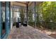 Outdoor patio featuring two chairs, privacy screening, and paver flooring at 10577 Down Lakeview Cir, Windermere, FL 34786