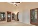 Room with high ceilings offering backyard views and plenty of natural light at 10577 Down Lakeview Cir, Windermere, FL 34786
