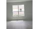 Bright bedroom featuring a large window with views of the neighborhood at 1134 Pando Loop, Orlando, FL 32824