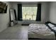 Bright bedroom with natural light, tile flooring, and a modern aesthetic at 1134 Pando Loop, Orlando, FL 32824