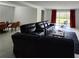 Living room with open floor plan, sleek tile floors, and sliding door access at 1134 Pando Loop, Orlando, FL 32824