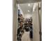 Walk-in pantry boasts floor-to-ceiling shelving and a door, providing ample storage space at 1134 Pando Loop, Orlando, FL 32824
