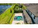 Aerial view of the property showing the pool and lake at 11689 Hampstead St, Windermere, FL 34786