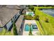 An aerial view of the property showing the pool and nearby lake at 11689 Hampstead St, Windermere, FL 34786