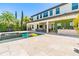 Beautiful backyard featuring a pool, jacuzzi, outdoor kitchen, and stylish patio seating area at 11689 Hampstead St, Windermere, FL 34786