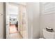 Bathroom showcasing a glass-enclosed shower and toilet with neutral tile flooring and fixtures at 11689 Hampstead St, Windermere, FL 34786