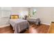 Comfortable bedroom with hardwood floors, two twin beds and natural light at 11689 Hampstead St, Windermere, FL 34786