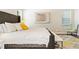 Comfortable bedroom with stylish decor, a patterned rug, and an accent chair at 11689 Hampstead St, Windermere, FL 34786