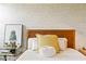 Comfortable bedroom boasts natural light and a cozy atmosphere, with a focus on the bed and décor at 11689 Hampstead St, Windermere, FL 34786