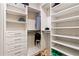 Well-organized closet space includes ample shelving, drawers, and hanging rods for storage at 11689 Hampstead St, Windermere, FL 34786