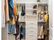Spacious closet with custom shelving, drawers and hanging racks provides functional storage solutions at 11689 Hampstead St, Windermere, FL 34786