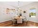 Dining area features a round table, hardwood floors and bright natural light at 11689 Hampstead St, Windermere, FL 34786