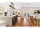 Bright kitchen features a large island with bar stool seating, and hardwood flooring at 11689 Hampstead St, Windermere, FL 34786