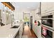 The modern kitchen features white cabinets, stainless appliances, and a large island at 11689 Hampstead St, Windermere, FL 34786
