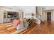 Warm living room with hardwood floors, modern decor, and staircase view at 11689 Hampstead St, Windermere, FL 34786