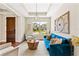 Cozy living room with a comfortable sofa, modern lighting, and a view of the neighborhood at 11689 Hampstead St, Windermere, FL 34786
