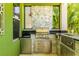 Outdoor kitchen area features stainless steel appliances and plenty of counter space at 11689 Hampstead St, Windermere, FL 34786