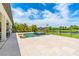 Beautiful pool area offering an inviting outdoor space with a jacuzzi and serene lake views at 11689 Hampstead St, Windermere, FL 34786