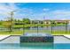 Backyard jacuzzi with serene lake views, perfect for relaxation and peaceful enjoyment at 11689 Hampstead St, Windermere, FL 34786