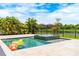 Gorgeous pool with jacuzzi, surrounded by lush landscaping and offering picturesque lake views at 11689 Hampstead St, Windermere, FL 34786