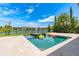 Stunning pool and jacuzzi with a beautiful lake view, perfect for relaxation and entertainment at 11689 Hampstead St, Windermere, FL 34786