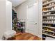 Organized walk-in closet with shelves and racks for shoes and clothes at 11689 Hampstead St, Windermere, FL 34786