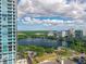 Scenic aerial view overlooking a beautiful lake with a vibrant cityscape in the background on a sunny day at 150 E Robinson St # 409, Orlando, FL 32801