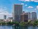 Picturesque aerial shot of the lake and skyline surrounded by lush greenery and a vibrant cityscape at 150 E Robinson St # 409, Orlando, FL 32801