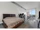 Bedroom with modern furniture, neutral colors, and a view at 150 E Robinson St # 409, Orlando, FL 32801