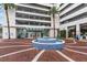 Elegant building entrance featuring a stylish water fountain, mature palms and welcoming architecture at 150 E Robinson St # 409, Orlando, FL 32801