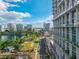 Stunning city view with a park and lake under a bright sky and a building at 150 E Robinson St # 409, Orlando, FL 32801