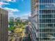 High-rise condo building overlooking a street with a picturesque view of a park and a lake at 150 E Robinson St # 409, Orlando, FL 32801