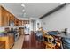 Bright open concept kitchen and dining area with hardwood floors and modern appliances at 150 E Robinson St # 409, Orlando, FL 32801