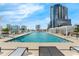 Rooftop pool with sun loungers and views of the city skyline in the background at 150 E Robinson St # 409, Orlando, FL 32801
