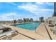 Rooftop pool with comfortable lounge chairs overlooking the downtown city skyline at 150 E Robinson St # 409, Orlando, FL 32801