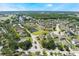 Beautiful aerial view of a community with well-manicured lawns, mature trees, and stunning waterways at 1920 Commander Way, Kissimmee, FL 34746