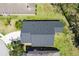Overhead shot of the house highlighting the roof, well-kept lawn, and the home's setting in a quiet neighborhood street at 1920 Commander Way, Kissimmee, FL 34746