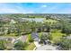 Aerial view of a home on a cul-de-sac, surrounded by lush greenery and well-maintained lawns in a Gathering-friendly community at 1920 Commander Way, Kissimmee, FL 34746