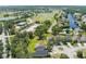 Real estate featuring a residence nestled amidst green trees, showcasing the property's location in a peaceful, established community at 1920 Commander Way, Kissimmee, FL 34746