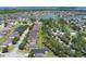 Real estate displaying the home and a community, underlining its positioning among tree-lined streets and recreational facilities at 1920 Commander Way, Kissimmee, FL 34746